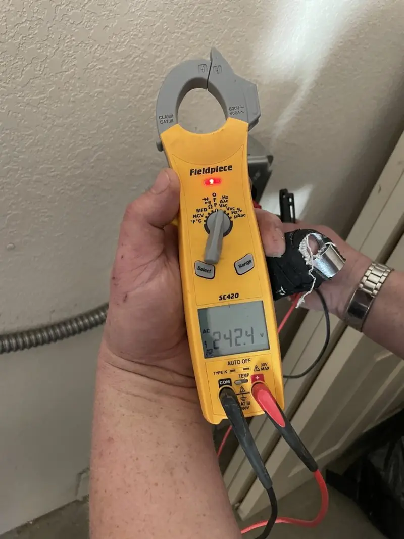 Voltage testing with clamp meter during Outlet Installation in Mount Carmel